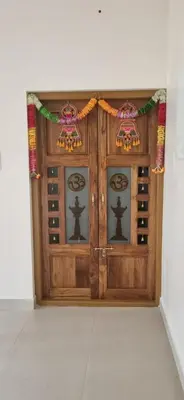 a wooden wine cellar with a wooden door at Agraharam Hindu Home stay - Advaitham in Palakkad