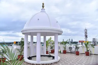 a white gazebo on the roof of a building at SAK Royal Residency 1 km from Railway Station in Mysore