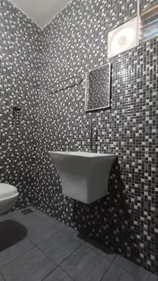 a bathroom with a bath tub and a toilet at SHI's Thulasi 2BHK in Coimbatore Near to Karpagam College, Palakkad Highway, Rathinam College and More in Coimbatore