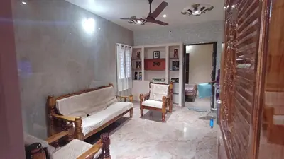 a living room with a couch and two chairs at SHI's Thulasi 2BHK in Coimbatore Near to Karpagam College, Palakkad Highway, Rathinam College and More in Coimbatore