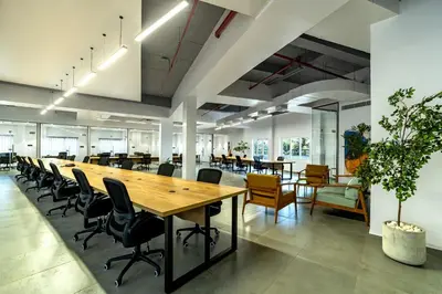 an open office with a long table and chairs at ESPERO INN Malappuram in Malappuram