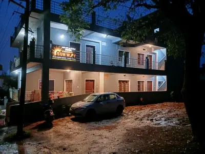 a car parked in front of a building at night at Coorg Sunway home stay in Madikeri