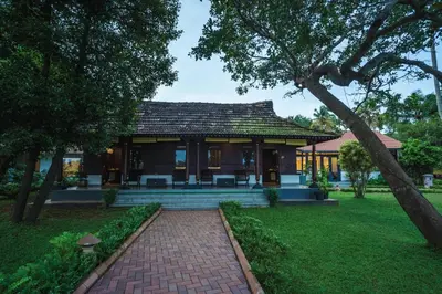 a house with a brick path in front of it at Vedic Village Retreat Kodungallur in Cochin