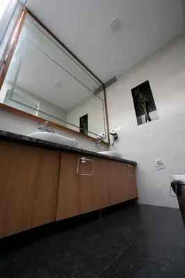 a bathroom with a sink and a large mirror at S R Private Residence in Mysore