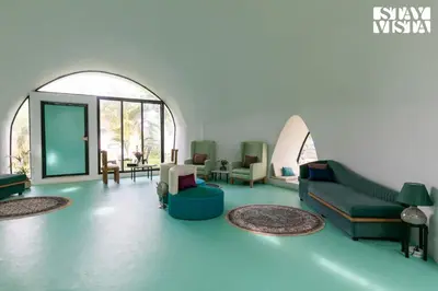 a living room with a couch and chairs at StayVista at Shwaas 4BR Mysore with Private pool and landscape in Mysore