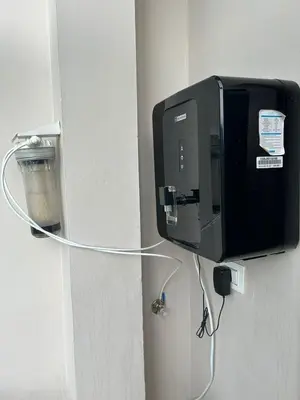 a tv attached to a wall with aumption at Padua Building in Irrity