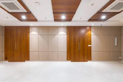 a room with wooden lockers in a building at Royal Embassy in Erode