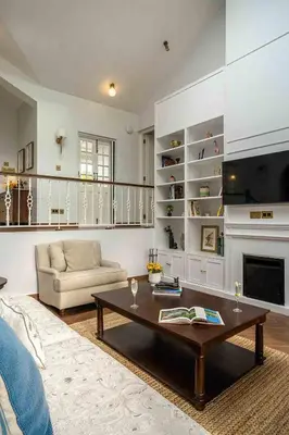 a living room with a couch and a coffee table at LohonoStays Villa Lansdowne in Coonoor