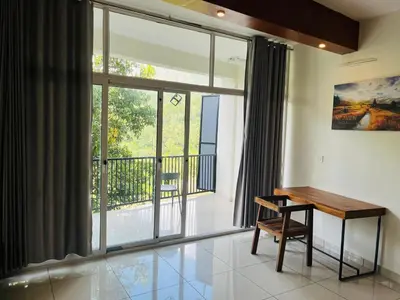 a room with a desk and a large window at Heaven Hills resorts in Vythiri