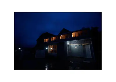 a house at night with its lights on at Haze cottage- MA Cottage in Ooty