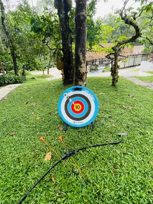 a frisbee laying on the grass in a park at The Hive at Druv Dakshin Farm Resort in Padinjarathara