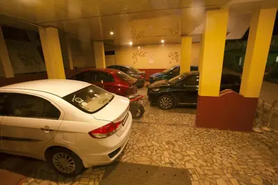a group of parked cars in a parking lot at Devi Enterprises - Hotel Khems in Ooty