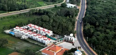 an aerial view of a resort with a road at Heritage Shelters Resort in Mysore