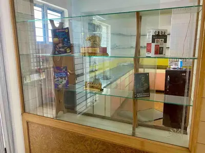 a glass display case in a store at Royal King Bed Suite, Service Apartments, 1km to center , Free WI-FI in Mysore