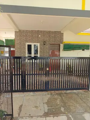 a black fence in front of a house at Ac 3 Bedroom House Mysore in Mysore