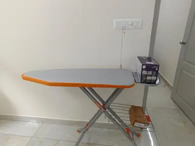 a table in the corner of a room at 7 Elysee Homestay - Lapis - Premium 3BHK Family Flat in Trichūr