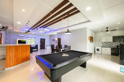 a large room with a pool table in it at River Serene Holiday home in Kizhake Chālakudi