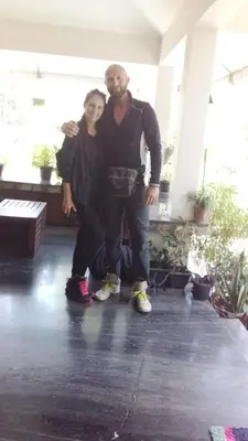 a man and a woman standing in a room at Shruthi's Aarohi-Nature's Retreat Homestay in Kannur