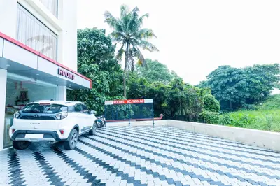 a white car parked at a gas station at Treebo Airsuite Airport Hotel in Cochin