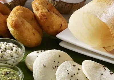 a group of breads and dips on a table at Bay View Suites, Vythiri, Wayanad in Wayanad