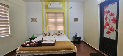 a bedroom with a bed with a basket on it at CASA DE CANOLI - A Private backwater villa in Kodungallūr