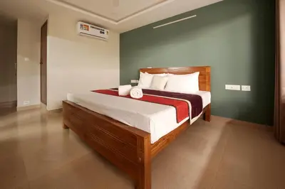 a bedroom with a large bed in a room at Span Avenue in Kozhikode