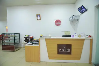 a pharmacy counter in a store with a sign on it at PitStop21 in Athirappilly