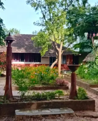 a garden in front of a house at Sradha Farm Stay - Kollengode in Kollengode