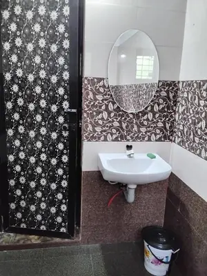 a bathroom with a sink and a mirror at Mitra retreats in Mānantoddy