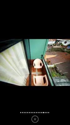 a room with a window with two toilets in it at Raahath Inn Munnar in Munnar