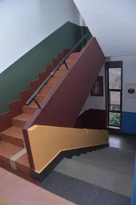 a set of stairs in a room with a door at Raahath Inn Munnar in Munnar