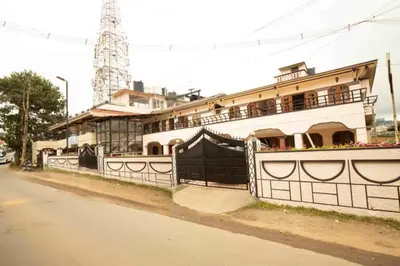 a building on the side of a street at Lazo Silver Lake , Ooty in Ooty