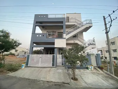aominium building with a staircase in front of it at Jk homestay Mysore in Mysore