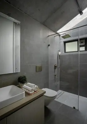 a bathroom with a toilet and a sink and a shower at LohonoStays Villa Amani 8B in Coonoor