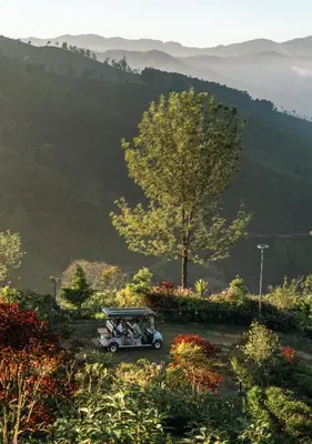a group of people riding in a golf cart at LohonoStays Amani Villa 9B in Coonoor