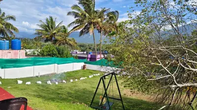 a view of a water park with a slide at Alappat Lodge Masinagudi in Masinagudi