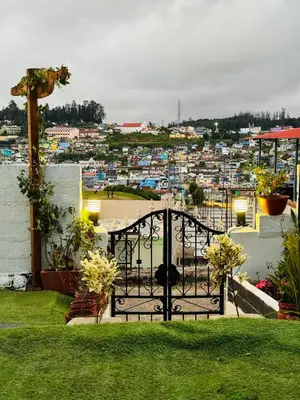 a gate with a view of a city at Casa Serenity in Ooty
