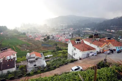 an aerial view of a town with houses at Ooty Horizon Heights in Ooty