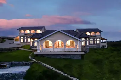 an overhead view of a large house with lights at Emerald Stays Ooty By VOYE HOMES - Italian Luxury near Ooty Emerald Lake in Ooty