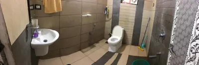 a bathroom with a toilet and a sink at 3 BHK HOUSE with nice facilities,Gate&Fence in Kunnamangalam