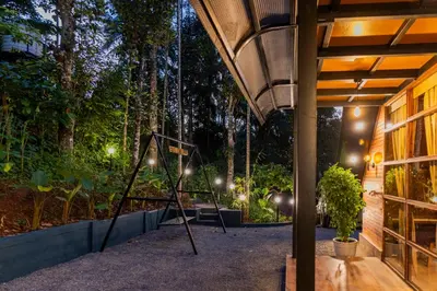 a basketball hoop in the middle of a garden at night at Ethnic Villa Wayanad in Kenichira