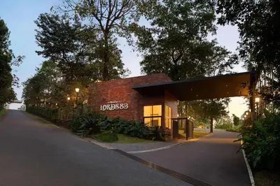 a building with a sign on the side of it at Morickap Lord's 83, Trademark Collection by Wyndham in Meenangadi