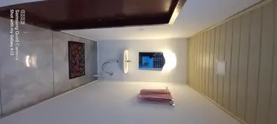 a room with a bed in the middle of it at Perumaal Homestay in Munnar