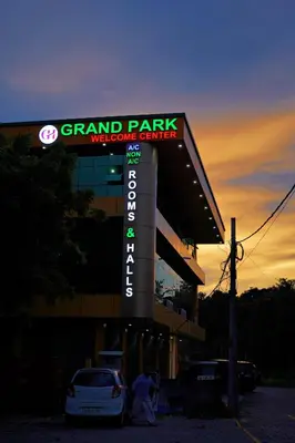 a sign for a grand park moisture center at sunset at GH Grand Park in Angamali