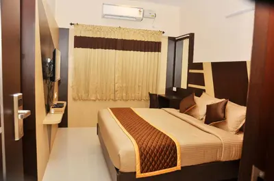 a bedroom with a large bed in a room at Harikrishna Park in Coimbatore