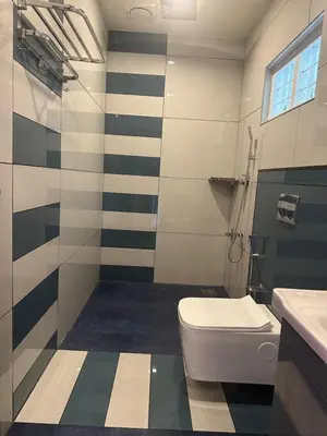 a bathroom with a toilet and a sink at Golden Hills cottage munnar Mankulam Munnar in Viripara