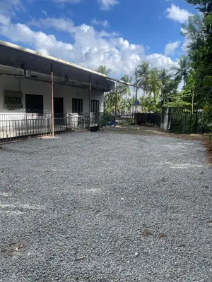 an empty parking lot in front of a building at Scott legacy in Kulattūr