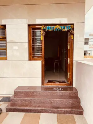 a staircase in a building with a window at A B House in Kollegālam