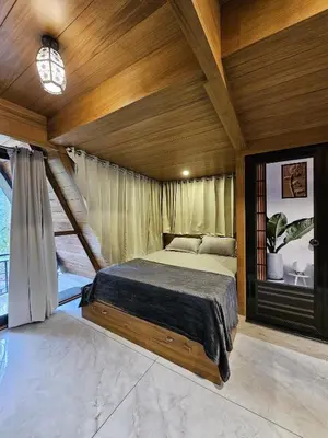 a bedroom with a bed in a room at Wild Castle Wayanad in Pulpally
