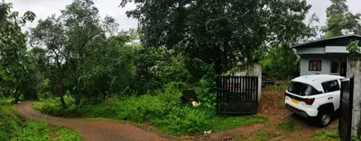 a white car parked in front of a house at Brahmagiri Homestay Serviced Villa in Thirunelli